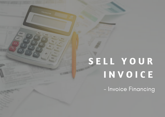 text: sell your invoice - invoice financing alongside calculator and pen on top of papers